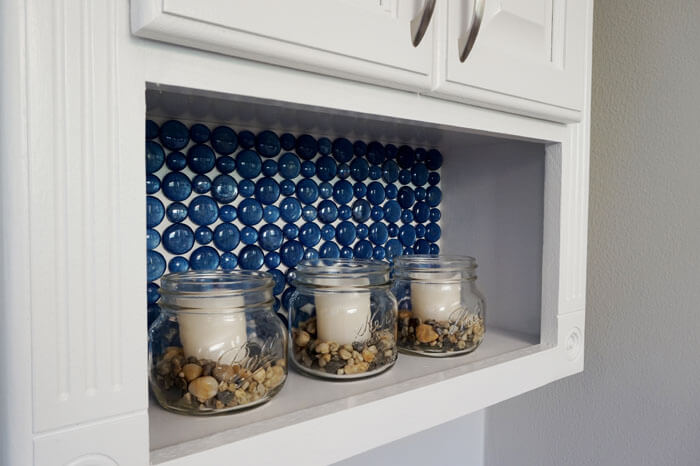 Wow, this beautiful glass backsplash was made with paint and Dollar Store beads. It's lovely, I'm stealing this idea!