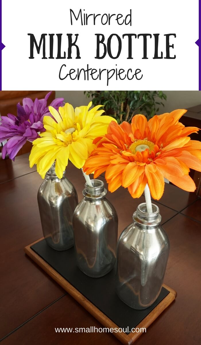 These mirrored milk bottles work beautifully as unique centerpiece! www.smallhomesoul.com