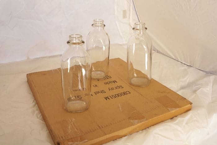 These mirrored milk bottles work beautifully as unique centerpiece! www.smallhomesoul.com