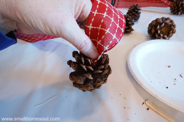Make this quick and easy Pinecone Swag for beautiful but inexpensive Christmas decorating.