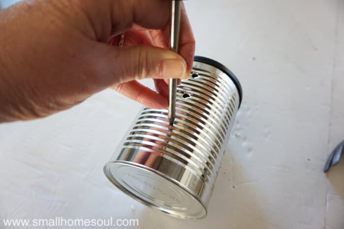 Making a recycled tin can lantern and planter is a great way to reduce, reuse, and recycle while making some great DIY decor for your garden or patio.